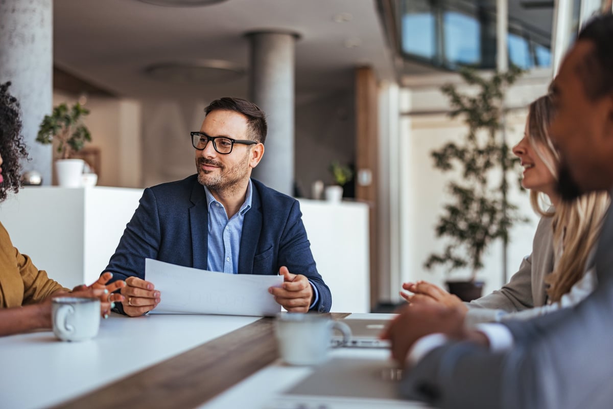 Professional corporate team collaborating in a modern office